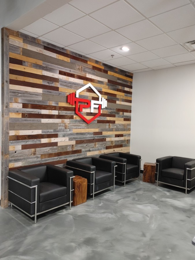 Peak Fitness Wall Logo Early 2022 we’ll take you to Oklahoma City to a project that our team built and installed fitness gym commercial cabinets for Peak Fitness.