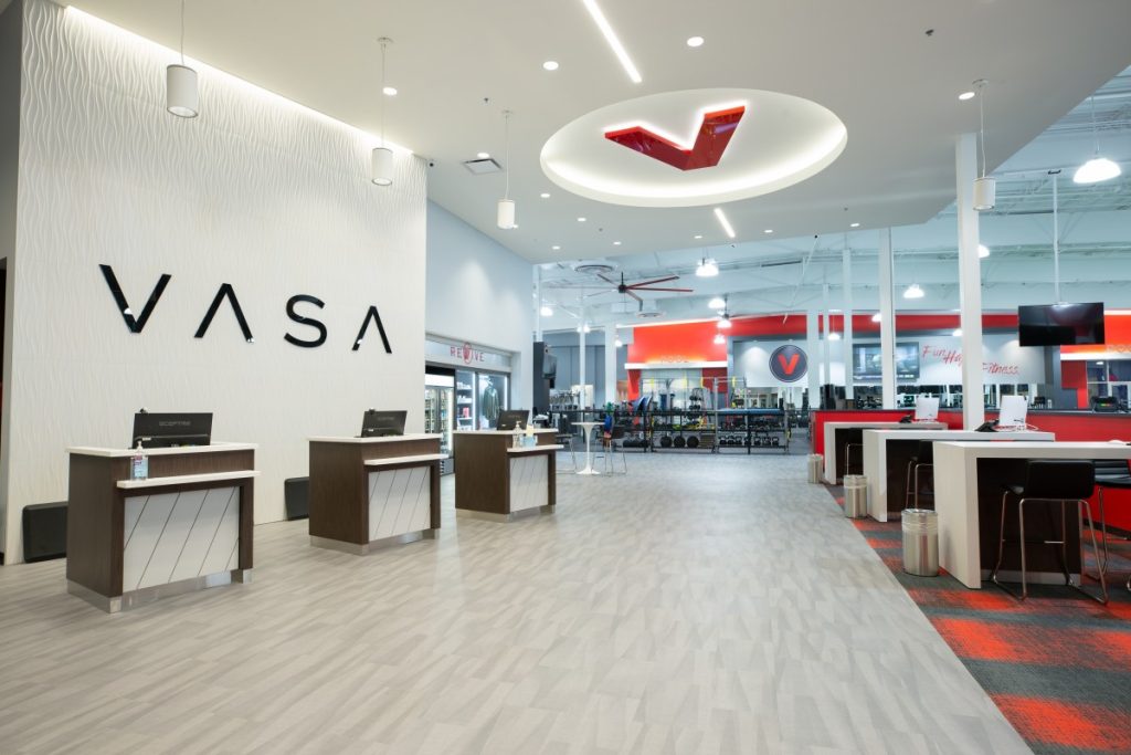 VASA North Orem UT Let’s take a look at this project involving fitness center custom cabinetry we built and installed for VASA Fitness of North Orem, UT.  The cabinetry for this fitness center included the reception desk/pods, sales desks, retail displays and signage.  From certified group fitness, yoga and KidCare programs to high-energy cycle rooms, swimming pools, and basketball courts, no one can match the dynamic variety of spaces, amenities, classes and equipment offered at VASA Fitness.